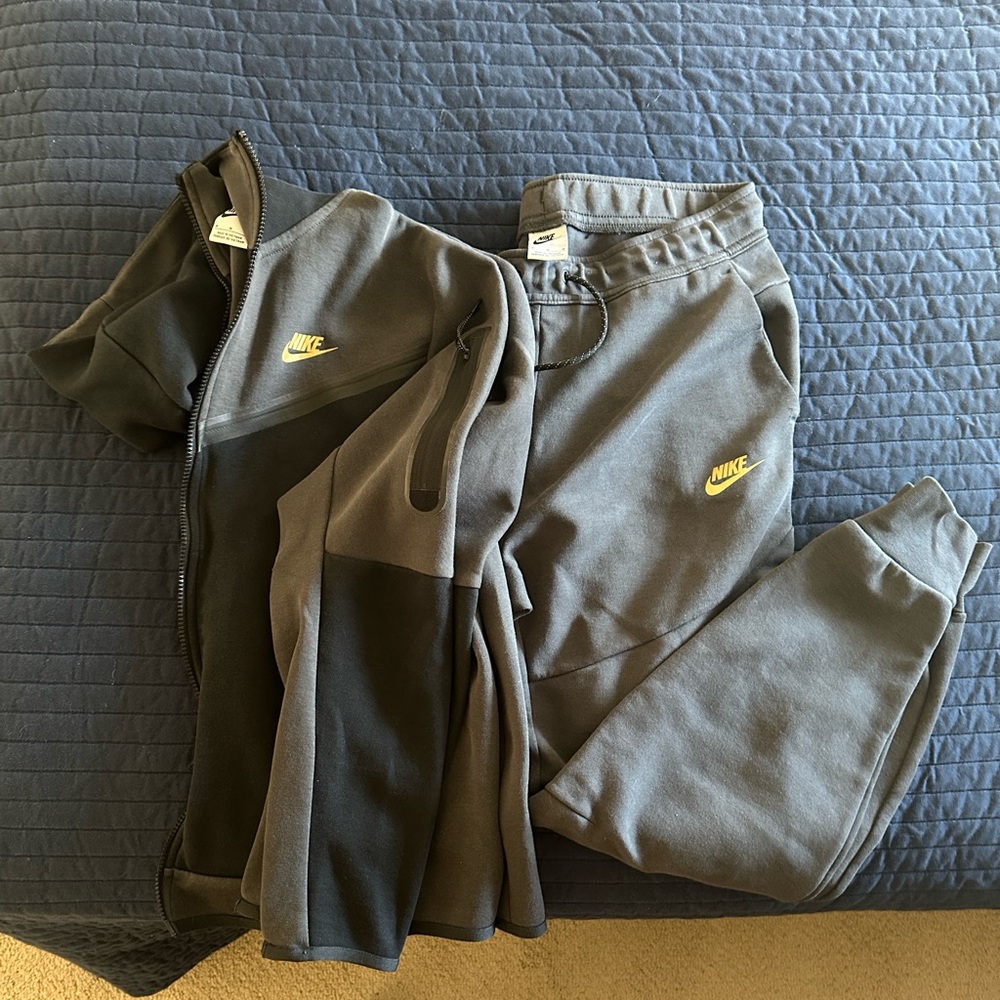 Nike Gray and Black Gold Logo Never worn but no tags.